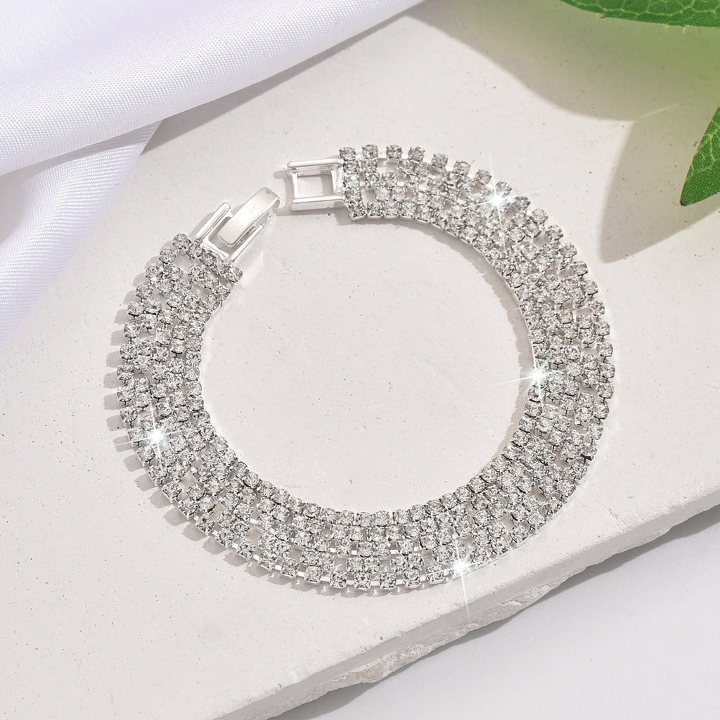 New store opening: Purchase a dress and receive a free Gold Rhinestone Jewelry Bracelet.