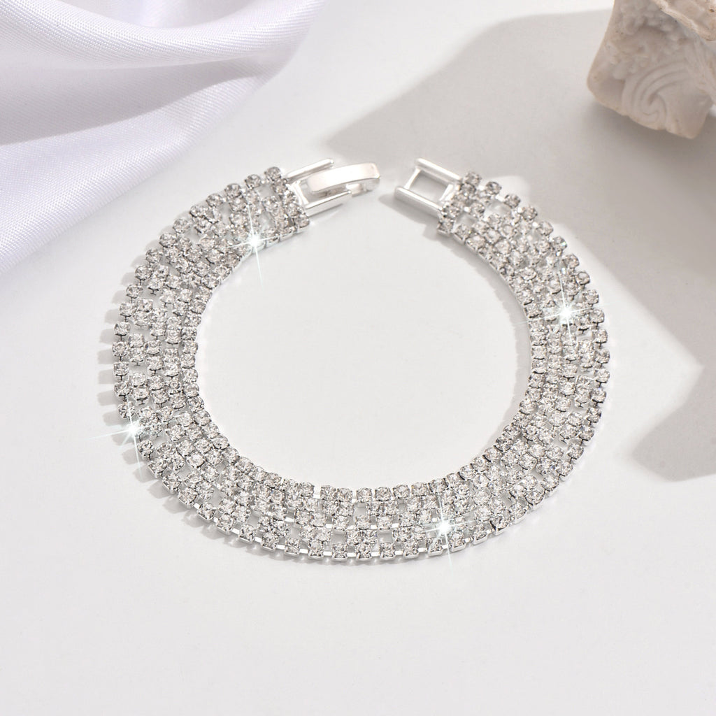 New store opening: Purchase a dress and receive a free Gold Rhinestone Jewelry Bracelet.