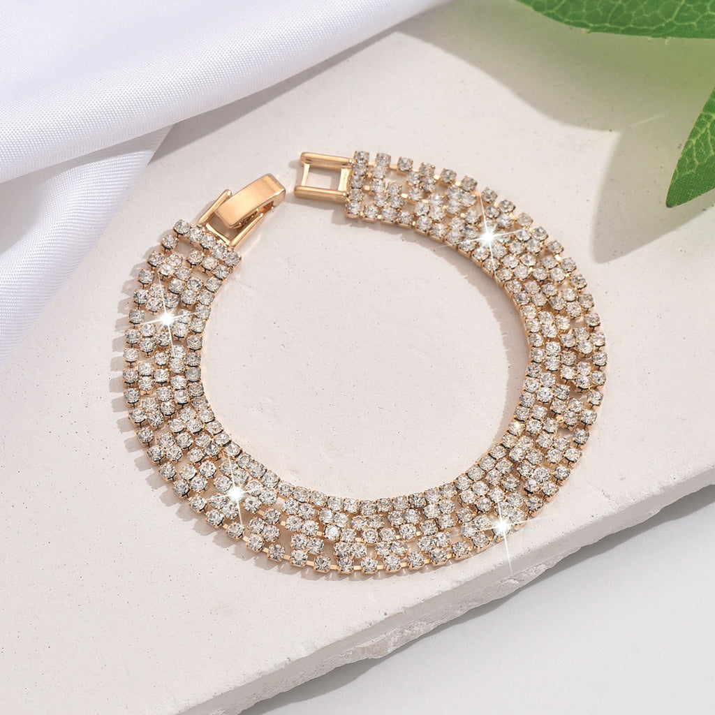 New store opening: Purchase a dress and receive a free Gold Rhinestone Jewelry Bracelet.