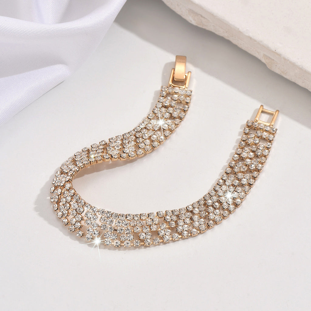 New store opening: Purchase a dress and receive a free Gold Rhinestone Jewelry Bracelet.