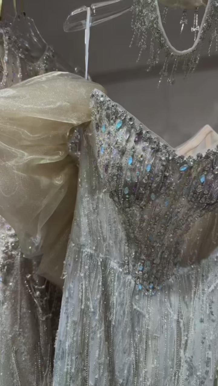TwinkleGowns SL213 Silver Crystal Beaded Off-Shoulder Evening Gown with Sheer Train