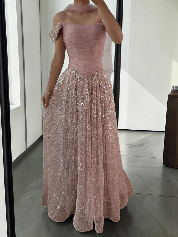 Twinkle Gowns blush pink off-shoulder ruched gown with beaded skirt and sheer scarf.